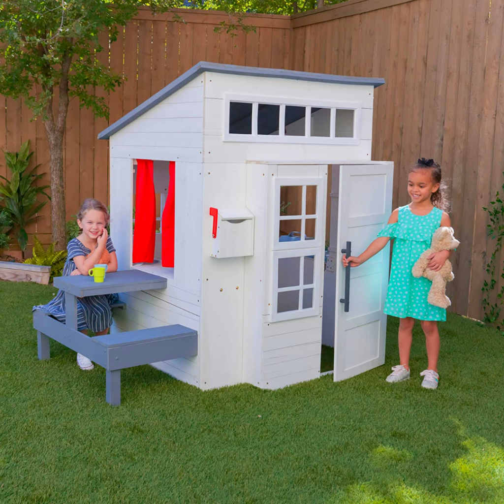 This painted wooden playhouse is the most adorable modern playhouse on the market!