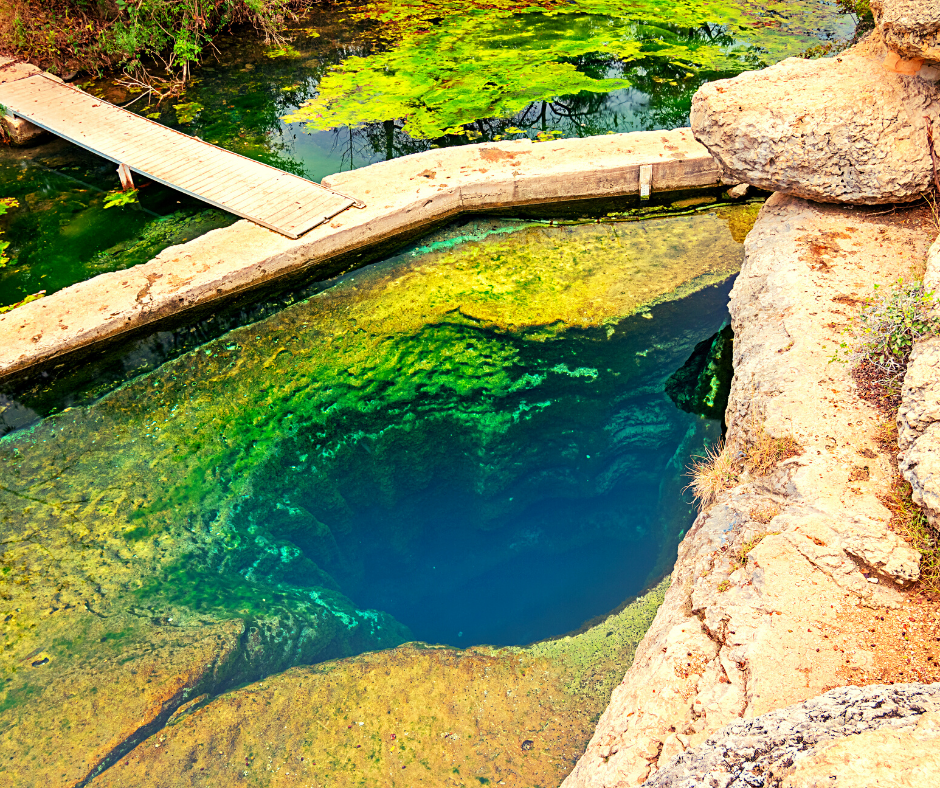 Jacobs Well in Wimberley Texas is one of the most stunning weekend getaways from Dallas. This unique spot is one of Texas' natural wonders and must be added to your Texas bucket list